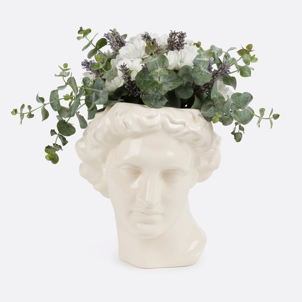 Vase apollon en céramique couleur blanc. Fleurs blanches feuilles vertes a l'intérieur pour illustrer. Grand Vase visage grec. KIPOK. Vase céramique visage pas cher. vase visage pot visage. Vase grecs.  objets décoration. Vase salon en céramique. vente vase en ligne.. vase tête. Vous cherchez un vase à la fois élégant et original pour mettre en valeur vos plus belles fleurs ? Découvrez notre vase visage Apollon, qui allie l'esthétique à la fonctionnalité. Vase pot.